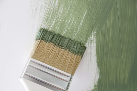 green paint on paint brush