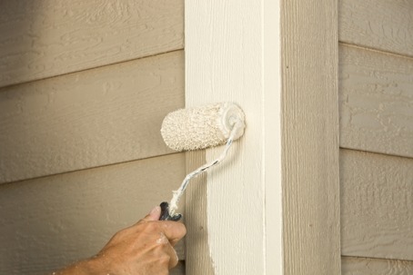 paint roller on exterior siding and trim