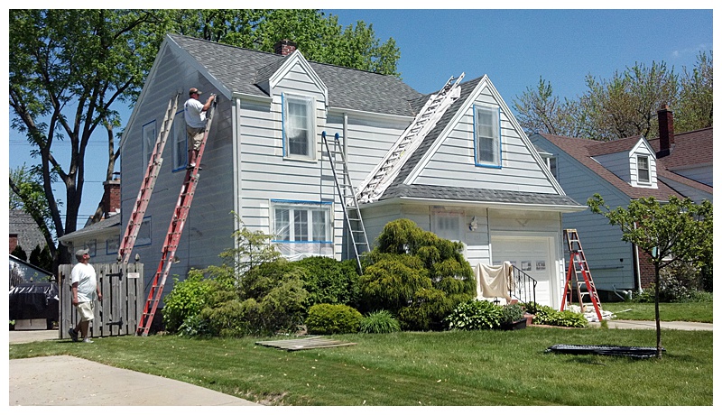 Paint of WNY painting Grey Vinyl Siding with White Shutters